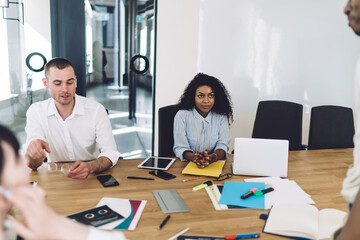 Sticker - Confident coworkers talking during meeting