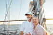 © Artem Varnitsin - Happy senior couple standing at mast. Two smiling people enjoying boat trip.
