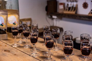 glasses with liqueur on a wooden table