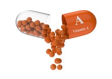 Open Capsule With Beta Carotene From Which The Vitamin Composition Is Pouring