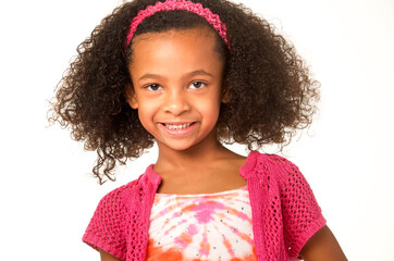 Smiling happy little girl with beautiful curly frizzy hair