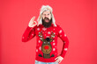 © be free - Loving cold weather. Christmas tradition. Christmas spirit and vibe. Happy new year. Join party. Winter outfit. Christmas sweater. Cheerful hipster bearded man wear christmas jumper and hat