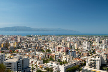 Albania, Vlore, cityscape seen from Kuzum Baba hill. Aerial city view, city panorama of Vlore with the monument of the partisans