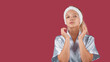 © Юрий Дровнин - Happy attractive woman in a silk robe posing for the camera, skin care concept