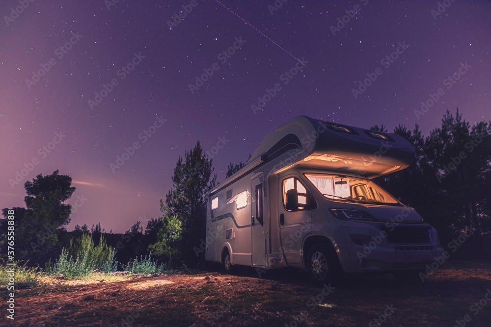 camper van caravan vehicle for van life holiday on mobile home camper mobile motor home RV campervan for an outdoor nomad lifestyle camper van journey camping in the parking in the forest - obrazy, fototapety, plakaty 