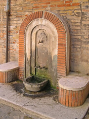 Wall Mural - Italy, Marche, Macerata, antique medieval public faucet near Annessione square.