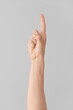 © Pixel-Shot - Hand showing letter Z on grey background. Sign language alphabet