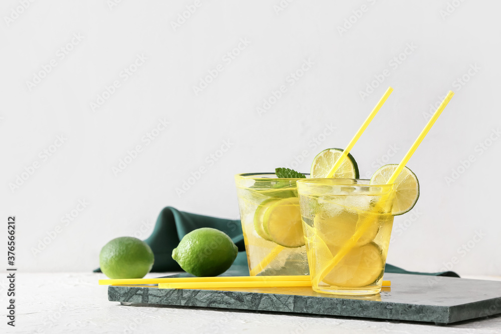 Cups of tasty cold ice tea on table