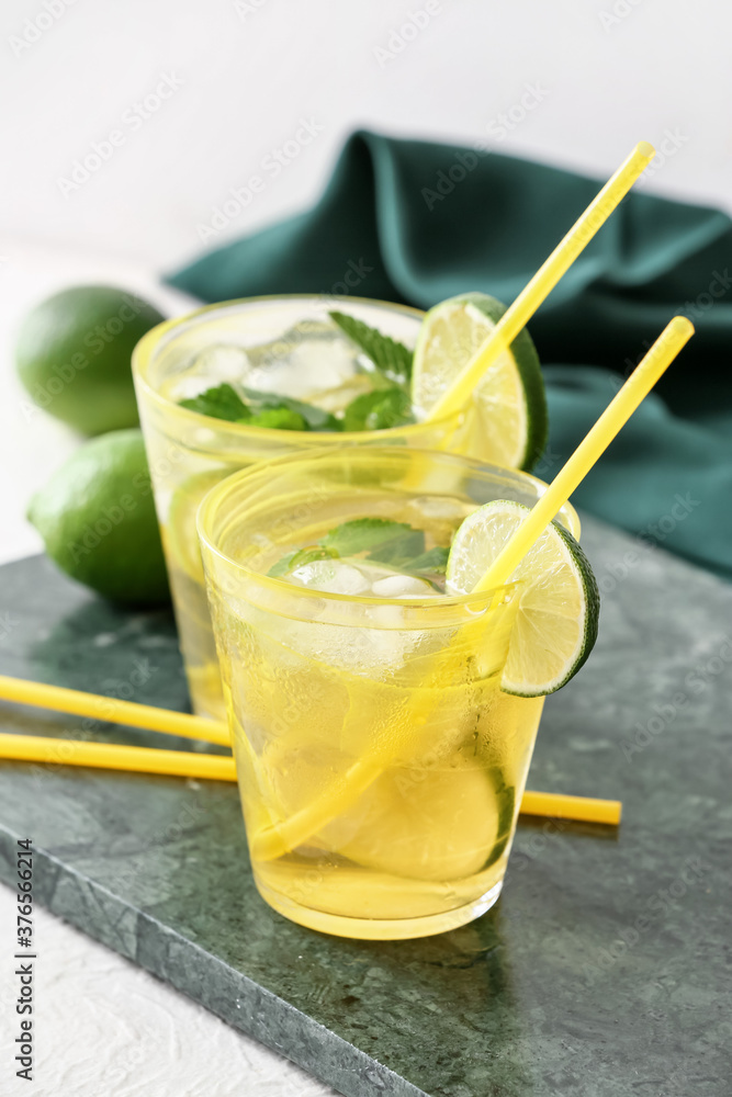 Cups of tasty cold ice tea on table