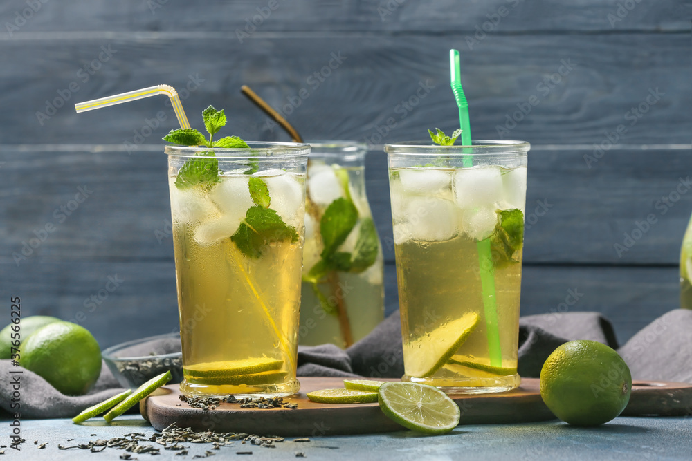 Glasses of tasty cold ice tea on table
