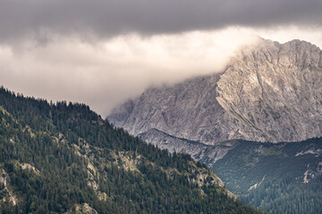 Wall Mural - mountain panorama of the karwendel mountains with clouds photo taken at the barmsee