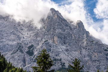 Wall Mural - mountain panorama of the karwendel mountains with clouds photo taken at the barmsee