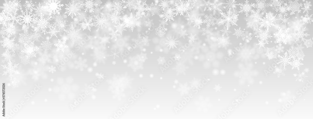 Christmas background of falling snowflakes in gray colors - obrazy, fototapety, plakaty 