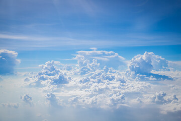 Sky and clouds from above the ground viewed from an airplane