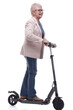 © ASDF - side view. modern elderly woman with electric scooter