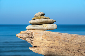 Stacked stones against sea