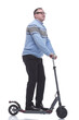 © ASDF - side view. successful modern man with electric scooter