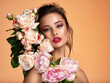 © Valua Vitaly - Attractive brunette girl with big beautiful  bouquet of  flowers. Beautiful white girl with flowers.  Pretty woman with bright makeup. Art portrait with flowers.