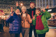© deagreez - Hello christmas father. Photo of full big family four members x-mas meeting gathering show v-sign advent generation outerwear hat scarf coat night street walk illumination outside outdoors