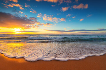 Wall Mural - Beautiful sunrise over the sea and tropical island beach