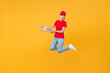 © ViDi Studio - Full length body fun delivery employee woman in red cap blank t-shirt uniform work courier in service jumping hold food order pizza in cardboard flatbox isolated on yellow background studio portrait.
