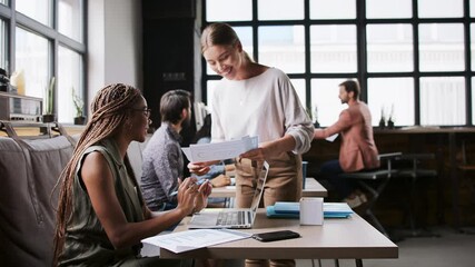 Wall Mural - Portrait of group of young businesspeople working indoors in office.