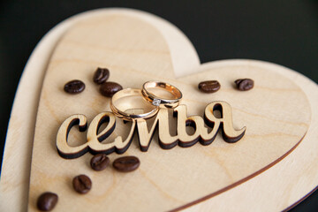 wooden box in the shape of a heart for rings with the inscription 