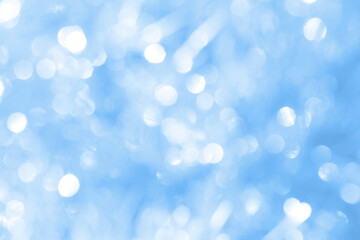 Bokeh light on blue background, sky with circle glitter light blue. Snow abstract soft glowing with vivid bright light and bokeh blur effect. 