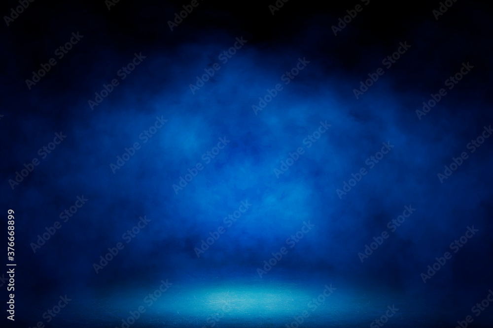 Empty space studio dark room with blue lighting effect and fog in black background. 