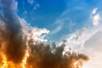 Wall Mural - sky and clouds nature background,yellow and orange sun light backside soft clouds in blue sky