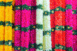 Indian traditional flower garlands. Yellow, Pink, White, Red fabric flowers decoration for indian festival.