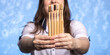 © Олег Кононов - a lot of bamboo toothbrushes in female hands close-up. girl with a smile out of focus. ecologicaly clean. biodegradable hygiene items. multi-colored bristles. place for text. panoramic photo
