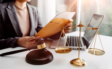 Wall Mural - Business and lawyers discussing contract papers with brass scale on desk in office. Law, legal services, advice, justice and law concept picture with film grain effect