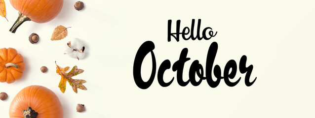 Wall Mural - Hello October message with autumn pumpkins with leaves