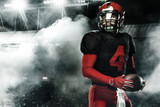 Fototapeta Przestrzenne - American football player, athlete sportsman in red helmet on stadium background. Sport and motivation wallpaper.