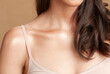 shoulder bone and neck of women with long brown hair