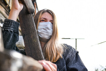 Girl wearing medical mask because of Air pollution or virus epidemic in the city. Woman with medical and face mask.