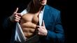 © Volodymyr - Fashionable young man wearing suit posing over black background. Handsome man posing in white shirt and dark blue suit. Sexy naked torso, six pack abs with open shirt.