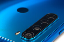 Blue Modern Smart Phone Multi Camera Lens And Fingerprint Scanner Close-up. Selective Focus.