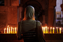Woman In Front Of Candles At Church Of The Holy Sepulchre, Jerusalem, Israel