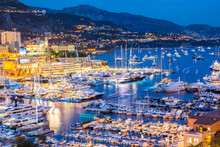 Elevated View Of Superyachts At Monaco Yacht Show At Dusk