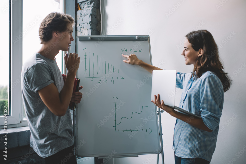 Person Explaining Data Clever woman with laptop computer explaining data numbers from chart on ...