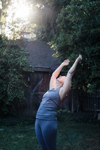 Senior Woman Doing Yoga Outdoors