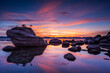 © Tandem Stock - Scenic view of Bonsai Rock in Lake Tahoe during sunset