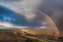 Scenic View Of Rainbow Over Rio Grande River And Sierra Del Carmen Mountain