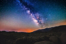 Scenic View Of Milky Way Over Rocky Landscape At Night