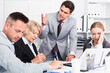 © JackF - Businessman feeling angry to coworkers in office, pointing out mistakes in work