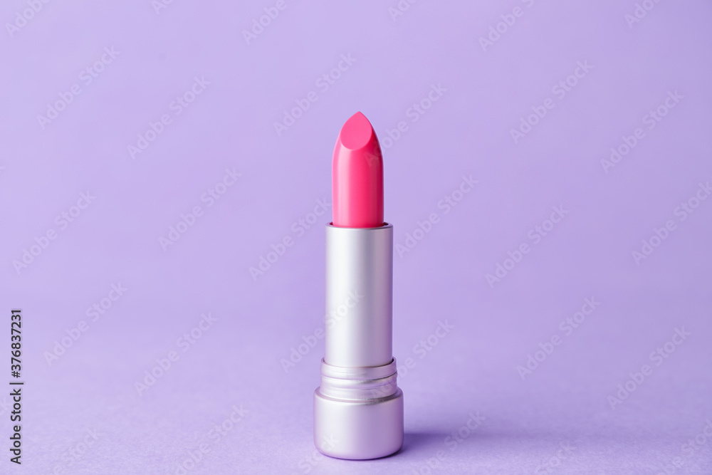 Beautiful lipstick on color background