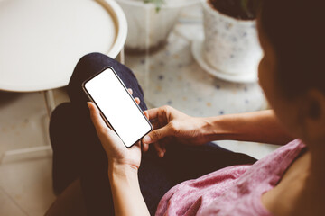 cell phone mockup blank white screen.woman hand holding texting using mobile on desk at coffee shop.background empty space for advertise.work people contact marketing business,technology