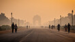 Silhouette of triumphal arch architectural style war memorial during hazy morning. Pollution level rises and causes smog in autumn season due stagnant winds.